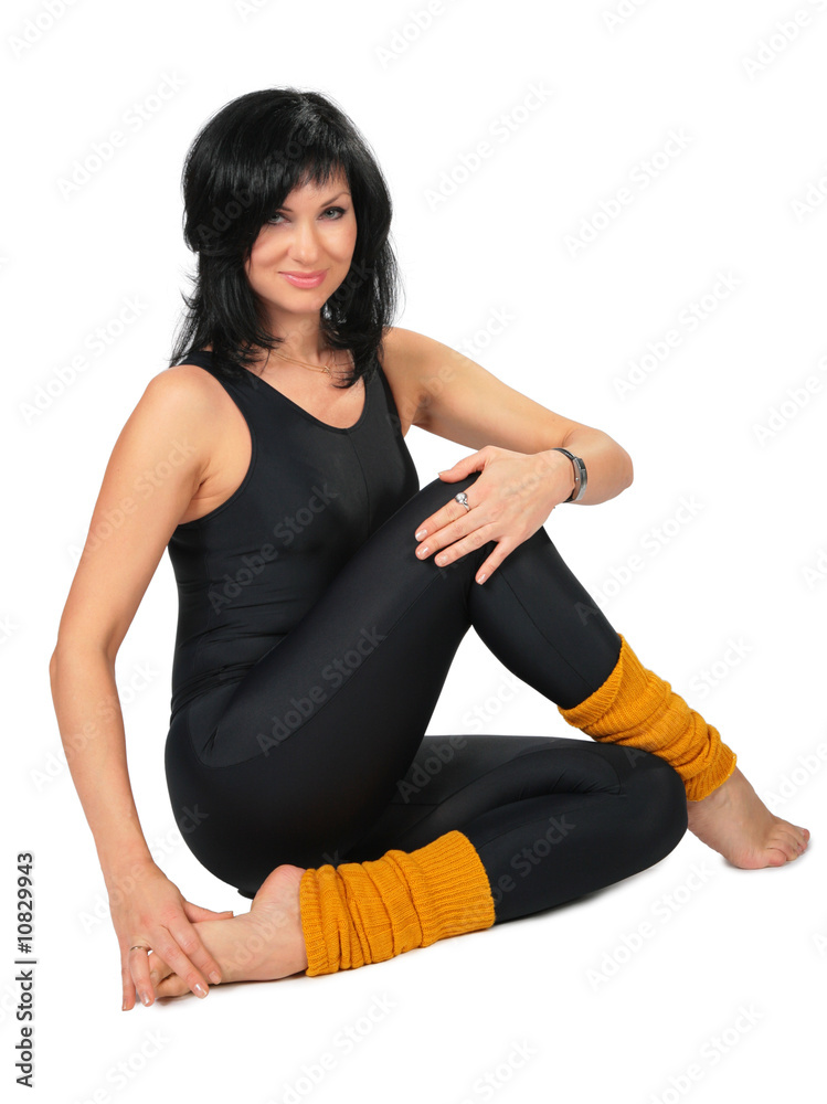 Sport brunette in black  makes gymnastic