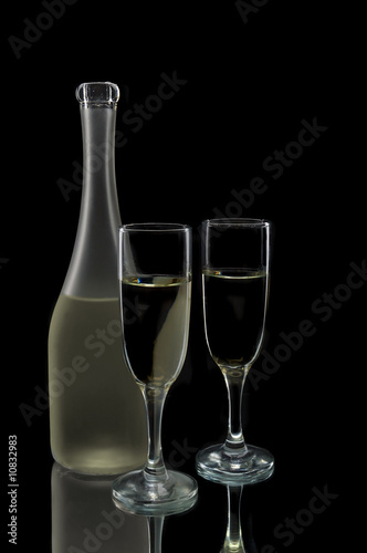 Pair of wine flutes and bottle