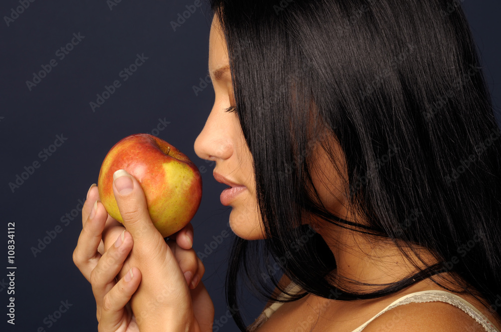 Beautiful exotic woman with apple
