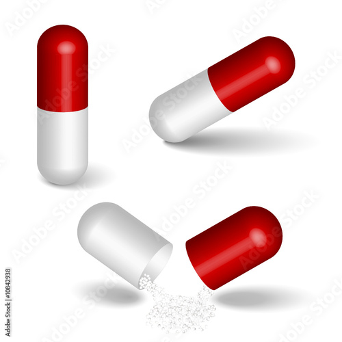 Red capsules isolated on white