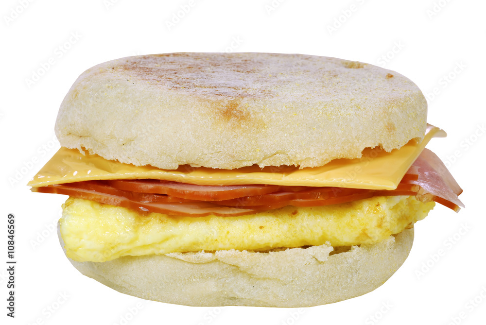 isolated scrambled egg cheese and ham on an english muffin isolated scrambled egg cheese and ham on an english muffin