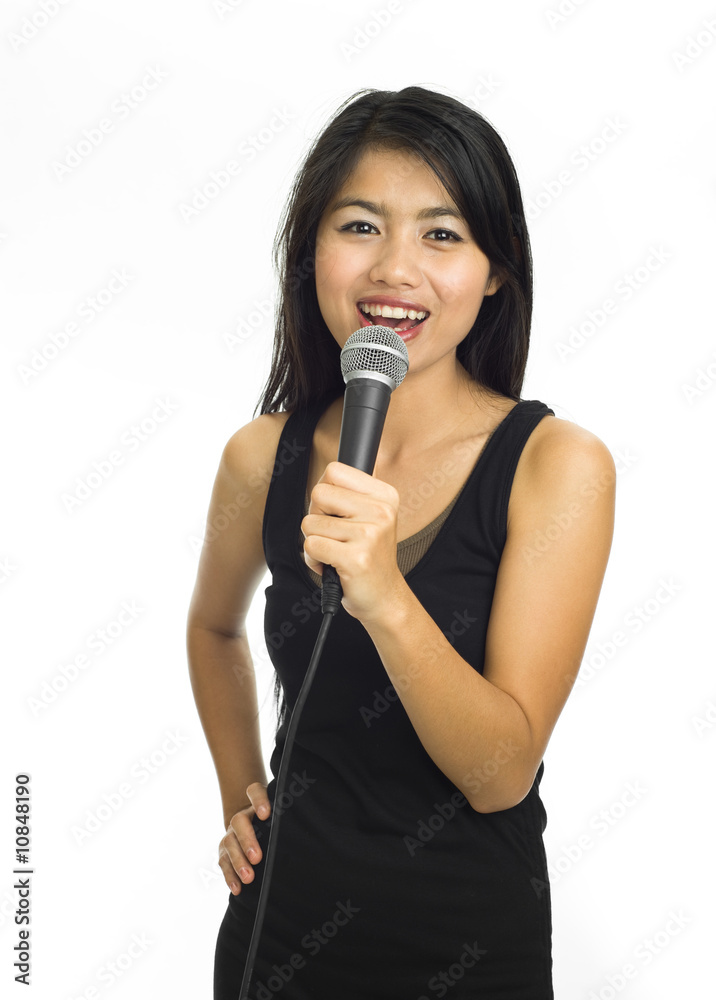 Young asian singing with microphone Young asian singing with microphone