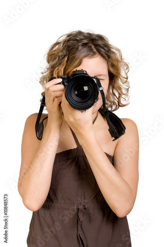 Young beautiful woman taking a photo with a camera © utflytter