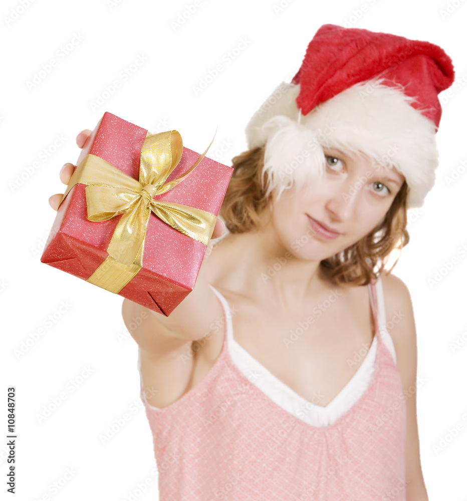 Girl in a santa clause cap with present Girl in a santa clause cap with present