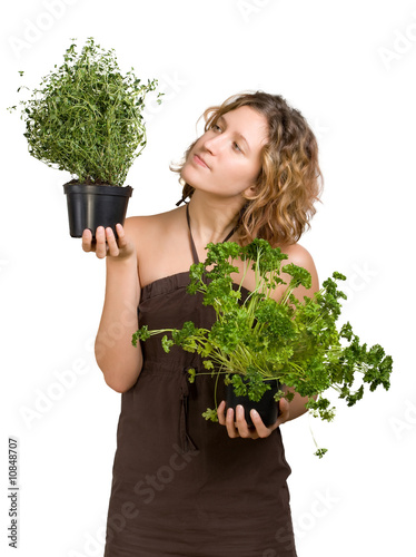 Young woman with culinary plants