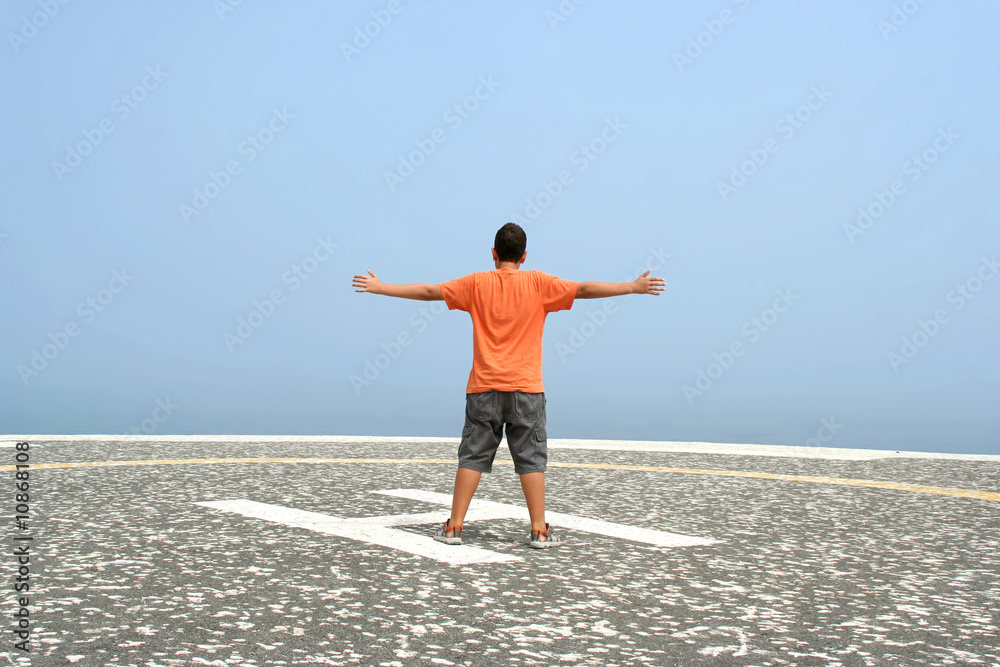 boy with arms wide open