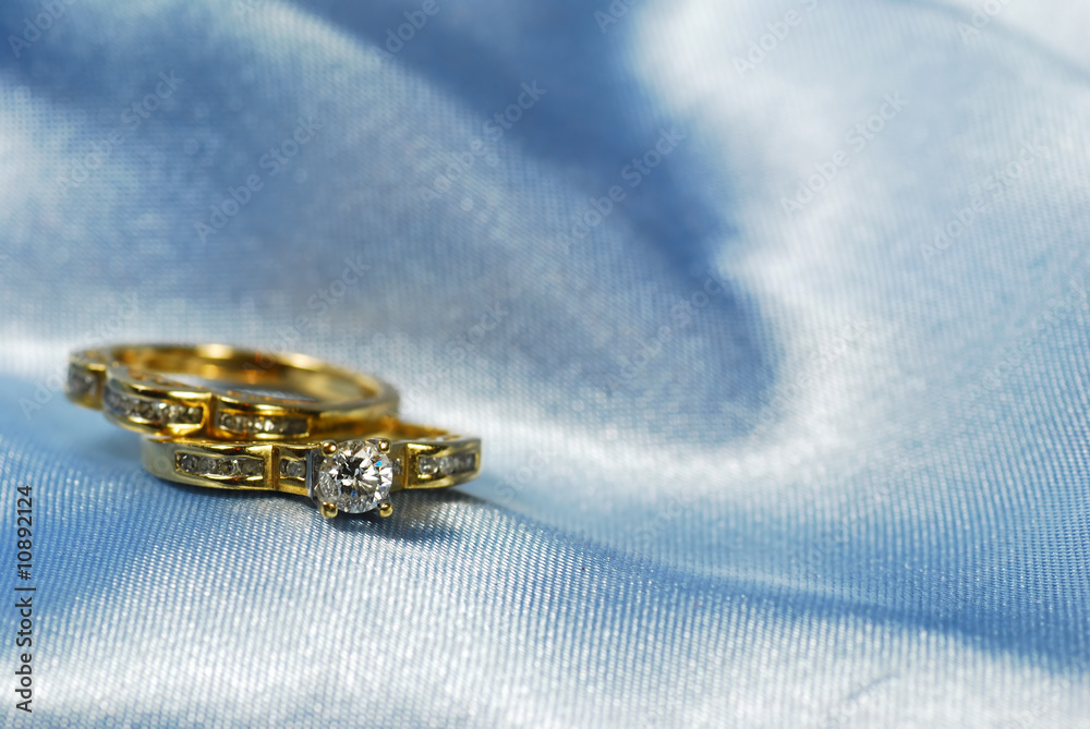 Diamond ring with wedding band on blue Diamond ring with wedding band on blue