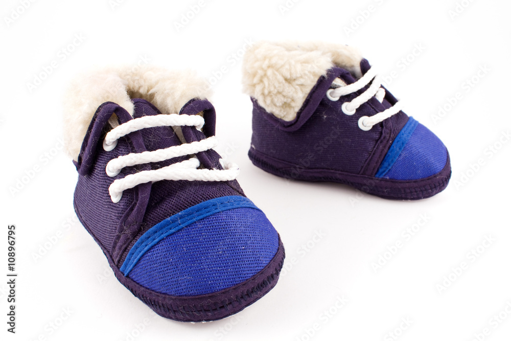 blue baby feet sneaker shoes isolated on white background blue baby feet sneaker shoes isolated on white background