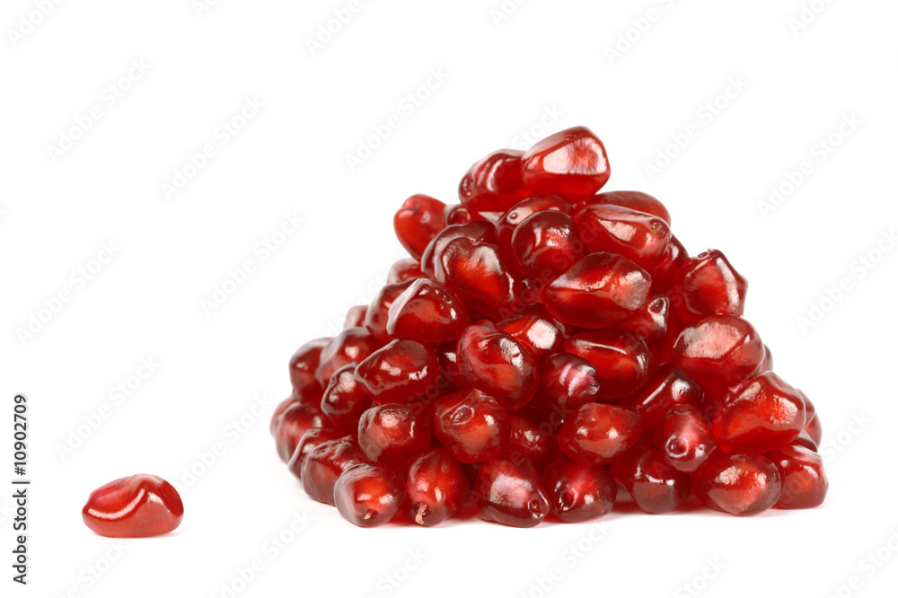 Heap of pomegranate seeds and one seed Heap of pomegranate seeds and one seed