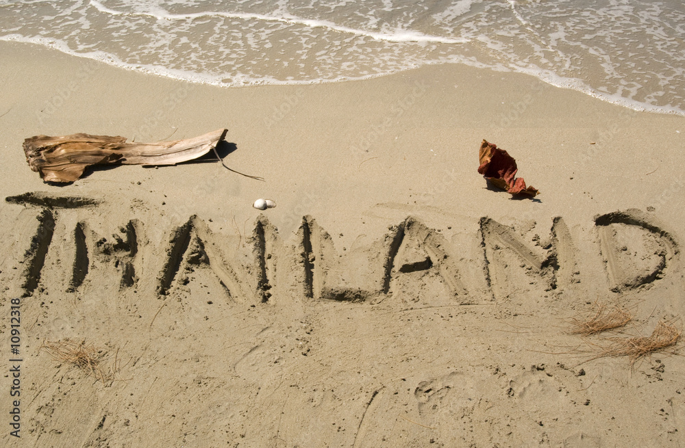 Obraz premium Thailand-Schriftzug im Sand