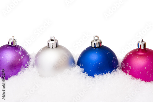 Christmas balls with snow isolated on white
