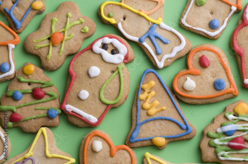 Gingerbread cookies on green background