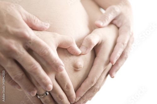 Baby on Board. Mom and Dad with hands on the baby