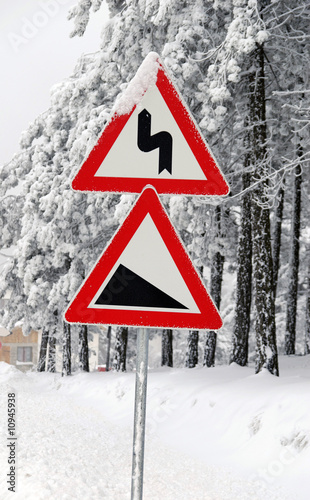 Traffic road sign in snow