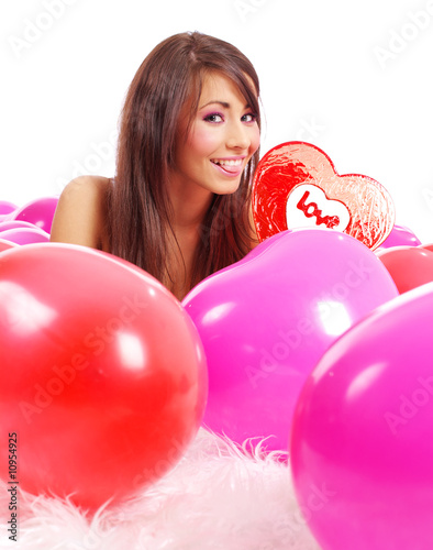 valentine's day, girl holding lollypop. balloons background