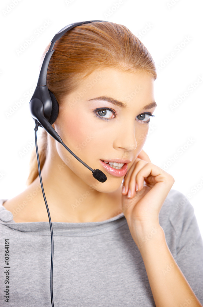 Beautiful girl is using headset, she isolated on white Beautiful girl is using headset, she isolated on white