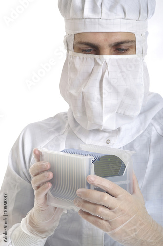 A man with silicon wafers in a box