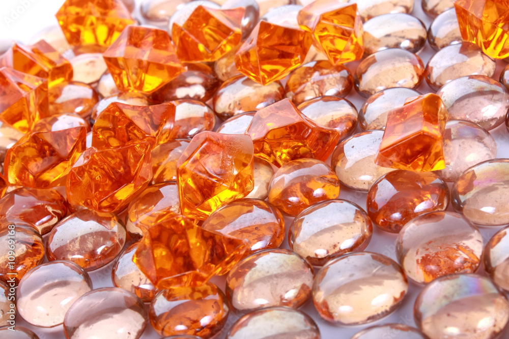 brown shiny stones and gems on white background brown shiny stones and gems on white background