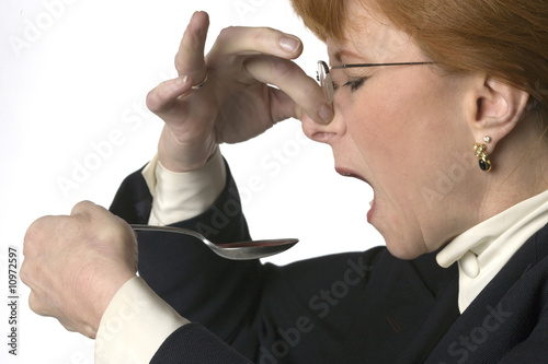Canvas Print Woman taking nasty medicine