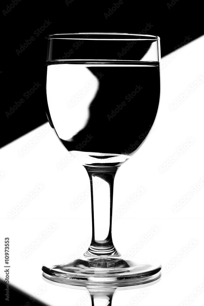 domino wine glasses in backlight on the black and white contrast domino wine glasses in backlight on the black and white contrast