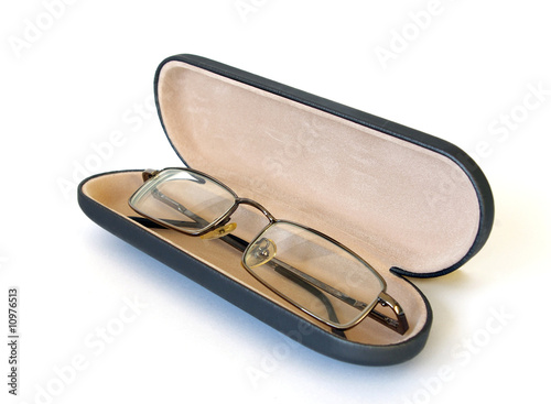 Glasses in spectacle case on white