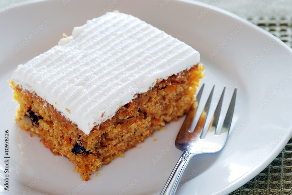carrot cake on a plate with fork