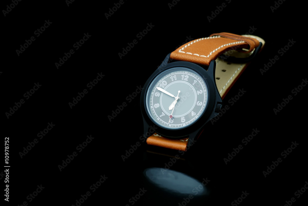 Classic Watch on a black background with a reflection Classic Watch on a black background with a reflection