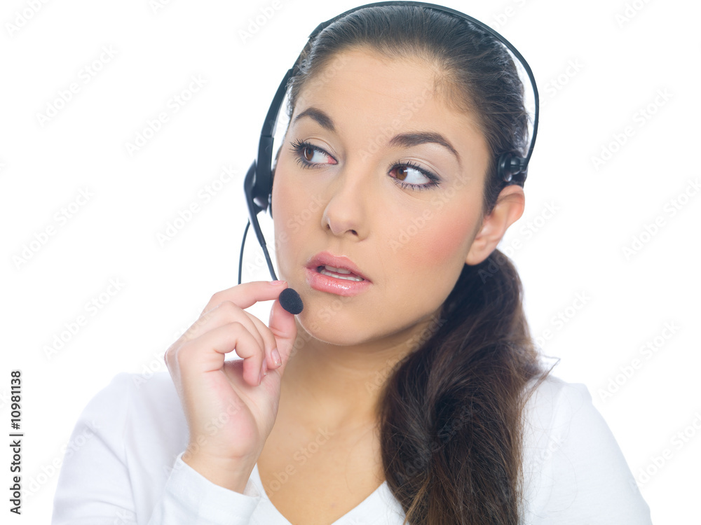 Beautiful girl is using headset, isolated on white Beautiful girl is using headset, isolated on white