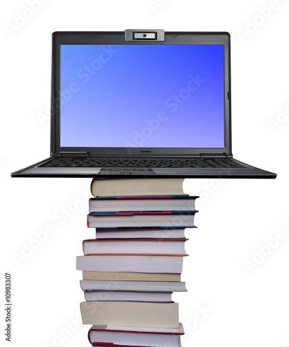 Laptop on a pile of books © PinkShot