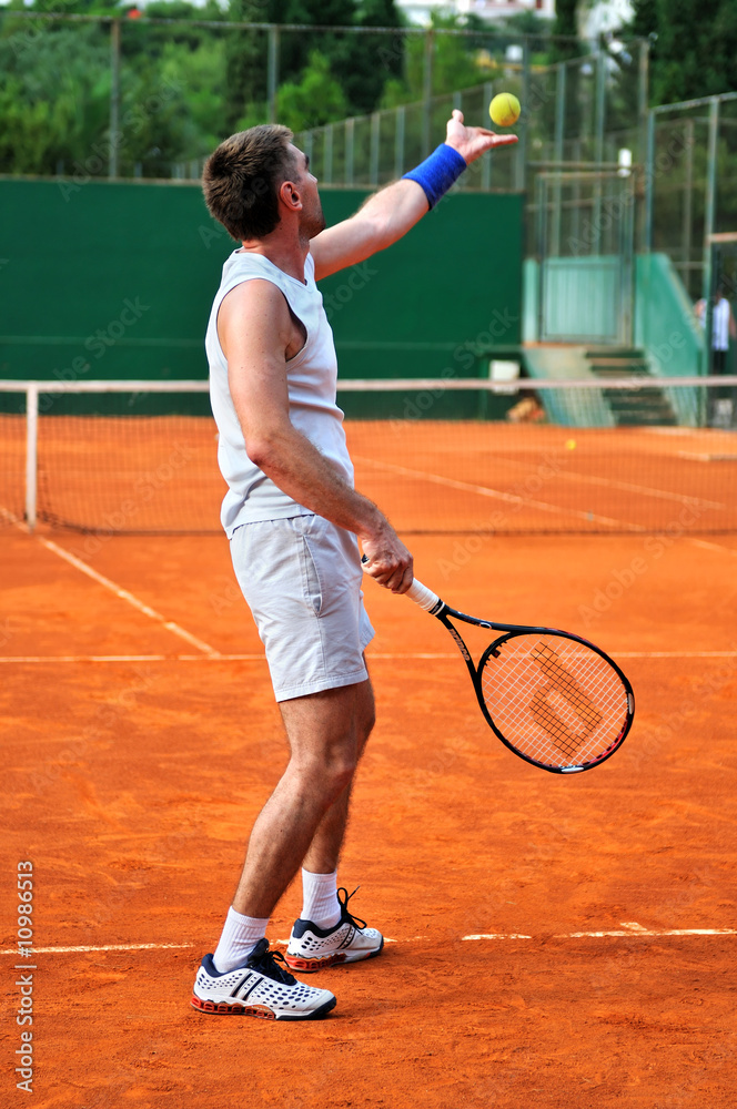 One man play tennis outdoors