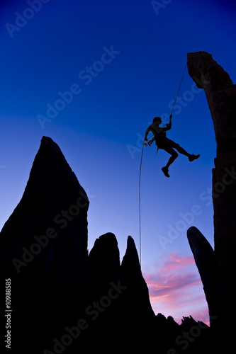 Climber rappelling.