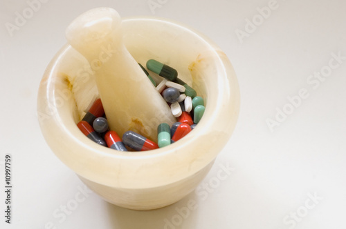 Pills in mortar-2 photo