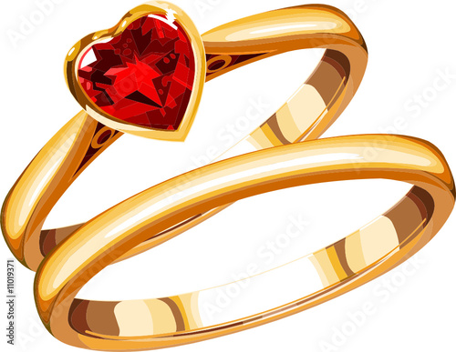two wedding rings on a white background