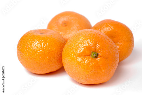 Four tangerines on white