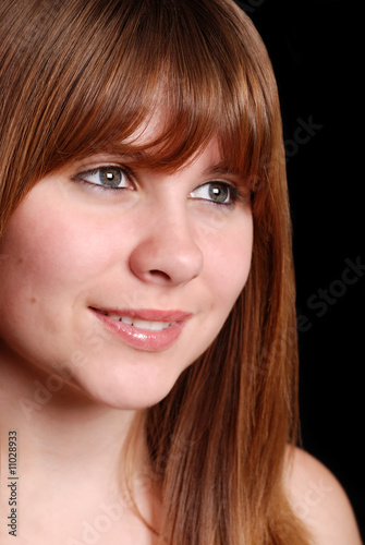 Teen female on a black background
