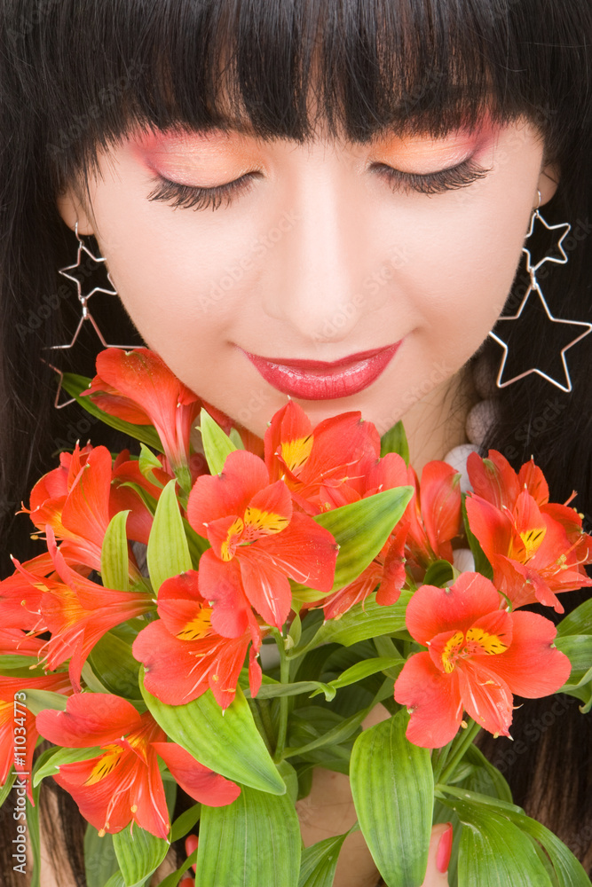 Naklejka premium Young woman with flowers