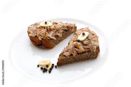 Two slices of bread with minced lard and garlic