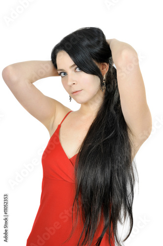 Beautiful brunette with long hair dressed in red