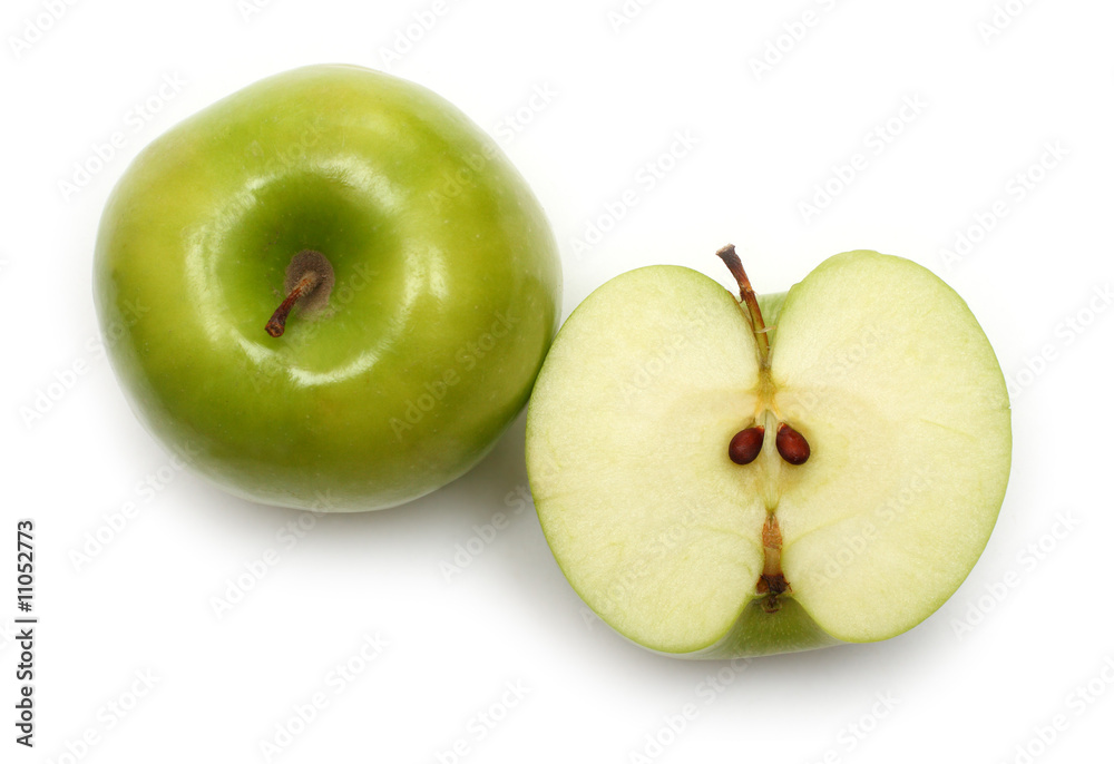 whole and sliced green apples
