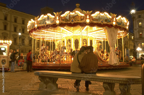 Lovers, carousel at night, Florence, Italy
