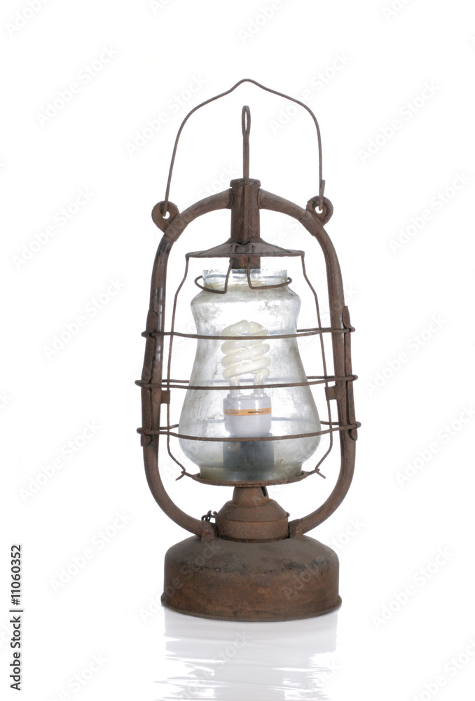 the old dirty kerosene lamp with modern bulb isolated the old dirty kerosene lamp with modern bulb isolated