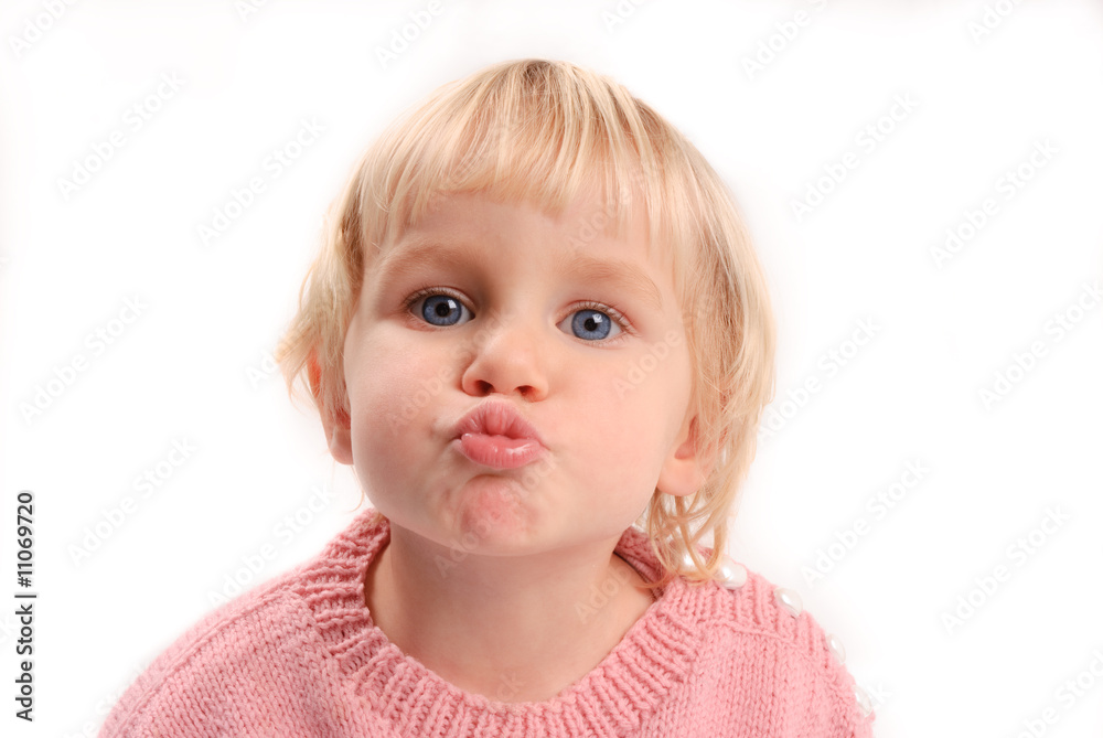 Little girl in pink knittet sweater moving to kiss Little girl in pink knittet sweater moving to kiss