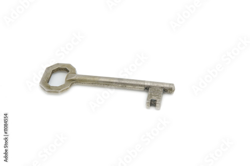 An old silver key isolated on white background © Daniel Vincek