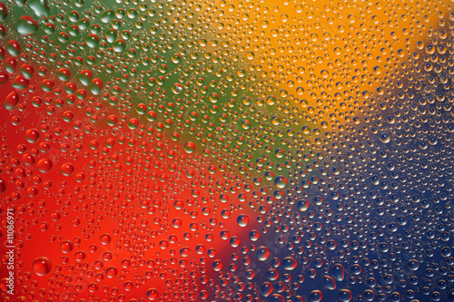 Motley water drops on glass