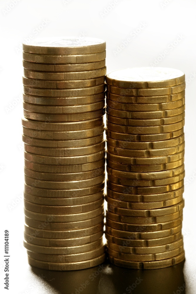 Euro coin columns, golden cash over white background Euro coin columns, golden cash over white background
