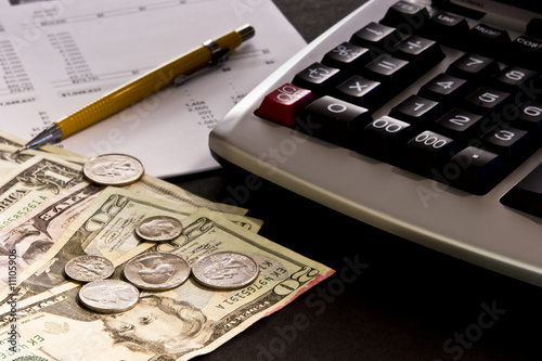 Money, calculator and financial statement