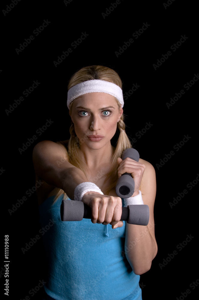 Woman exercising with weights Woman exercising with weights