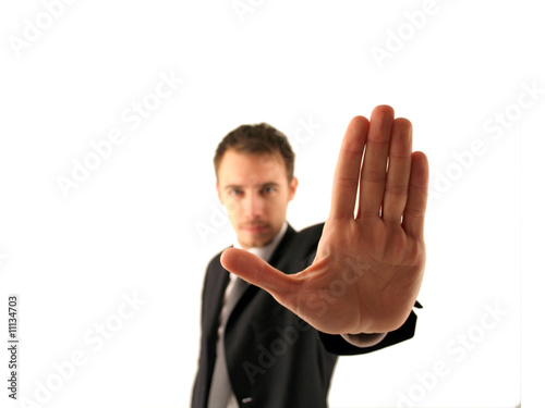 Young businessman saying STOP