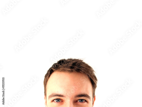 Young man behind a board