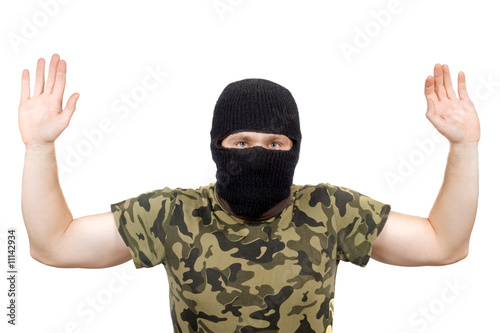 The surrendered criminal in a black mask over white © Sergey Sukhorukov